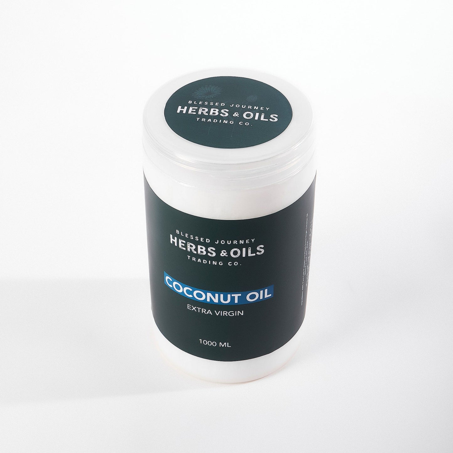 1000ml jar of extra virgin coconut oil by Herbs & Oils Trading Co. with black label on white background