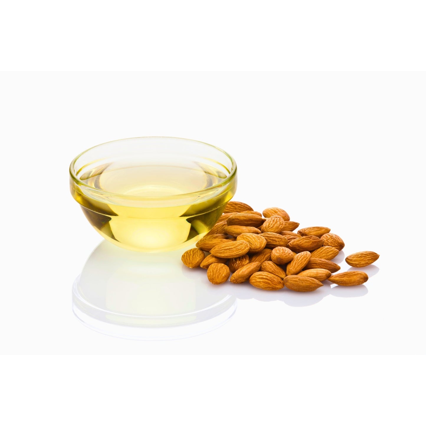 bowl of pure sweet almond oil with raw almonds on white surface