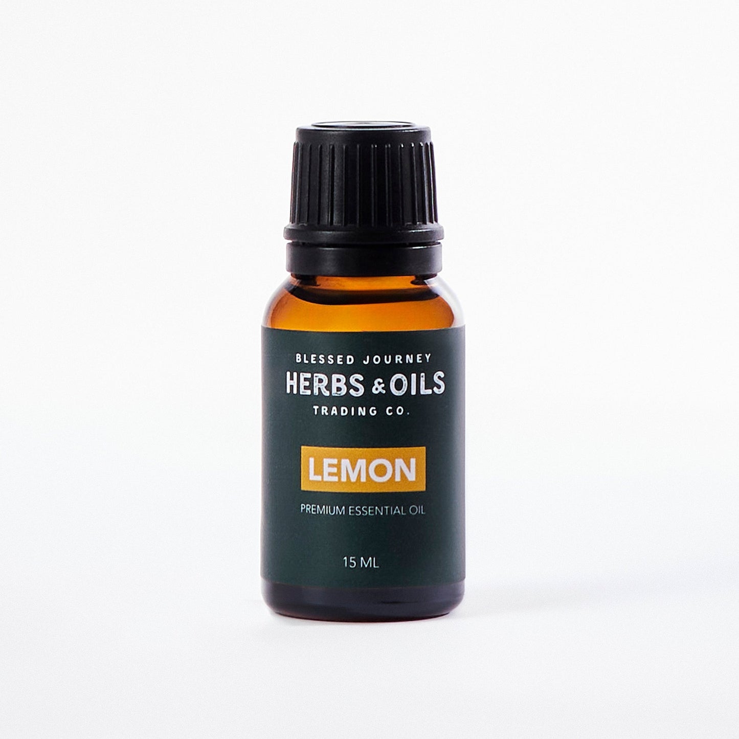 15ml amber glass bottle of pure lemon essential oil by Herbs & Oils Trading Co., labeled lemon premium essential oil