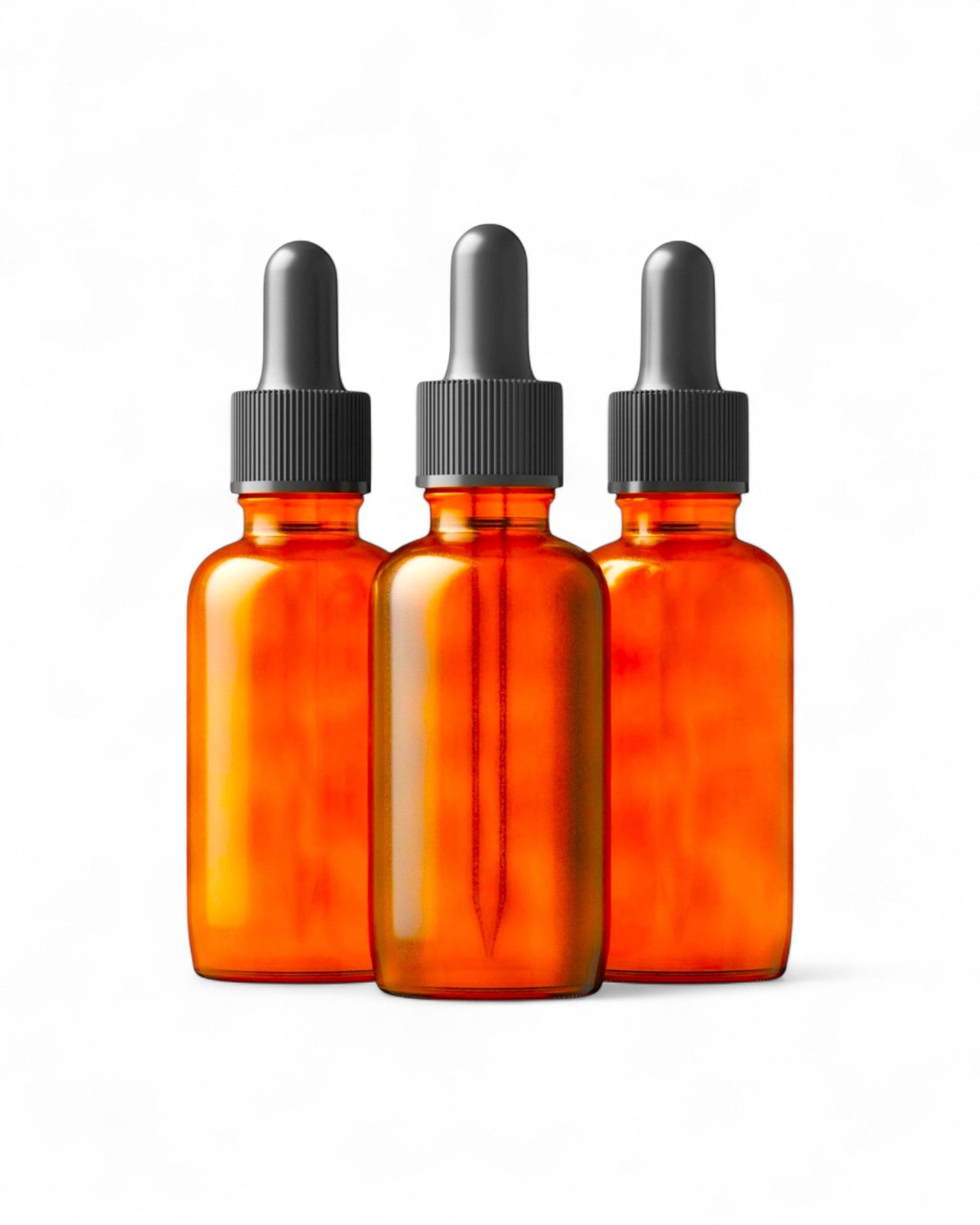 Set of three 50ml amber glass dropper bottles with black caps for essential oils and tinctures.