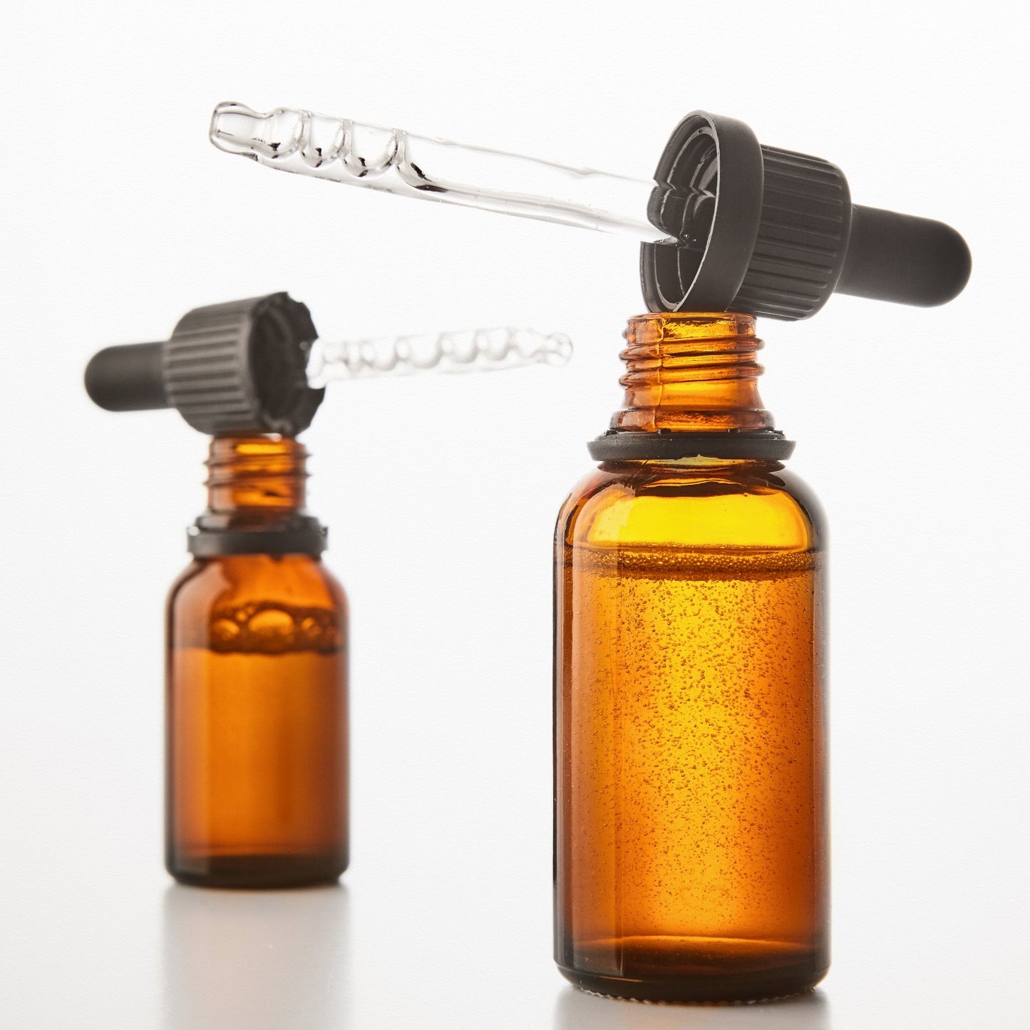 Amber glass dropper bottles with precision droppers for essential oils and tinctures protection