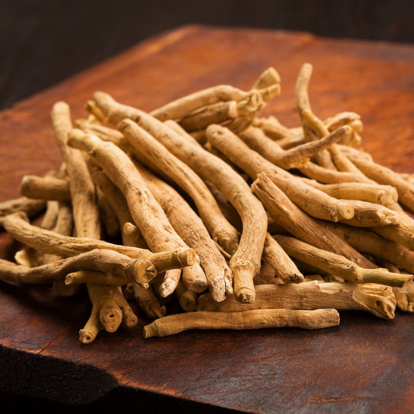 Premium Ashwagandha root sticks on wooden surface for natural wellness and stress relief