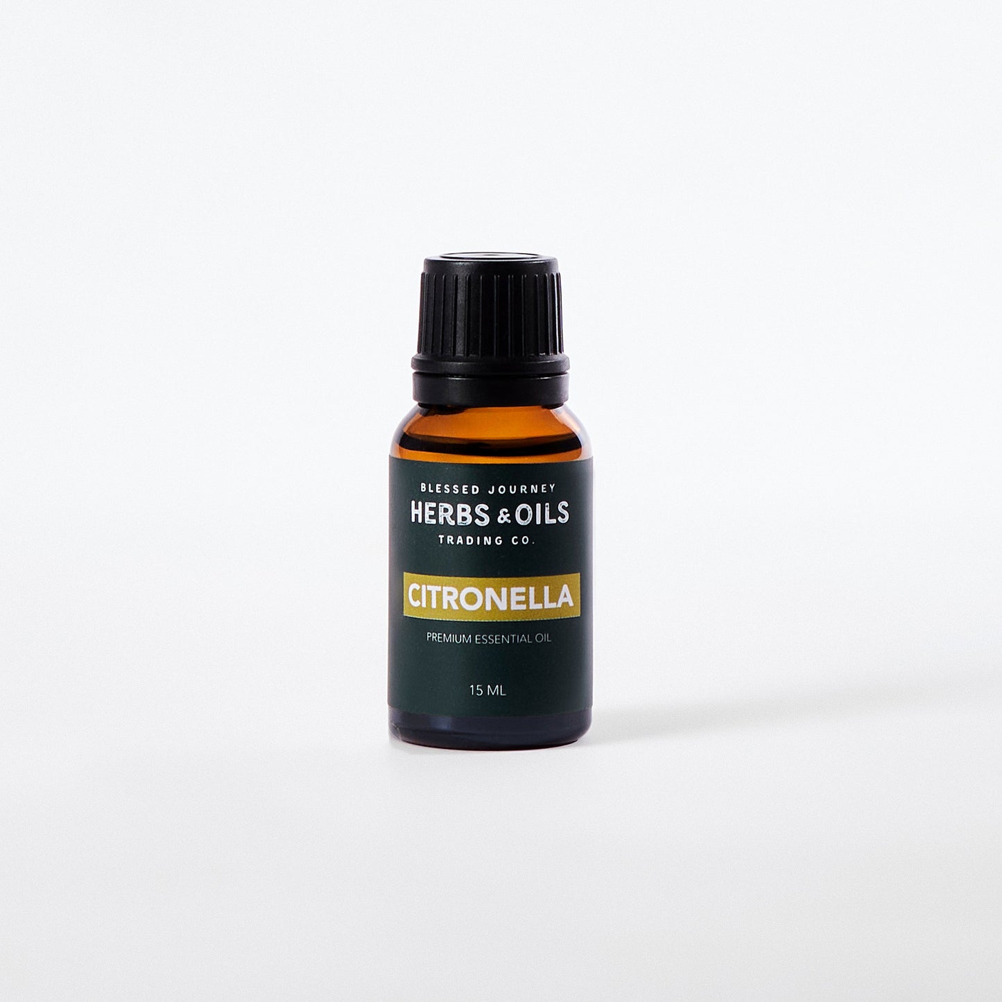 15ml amber glass bottle of citronella essential oil by Herbs & Oils Trading Co. with black cap and green label